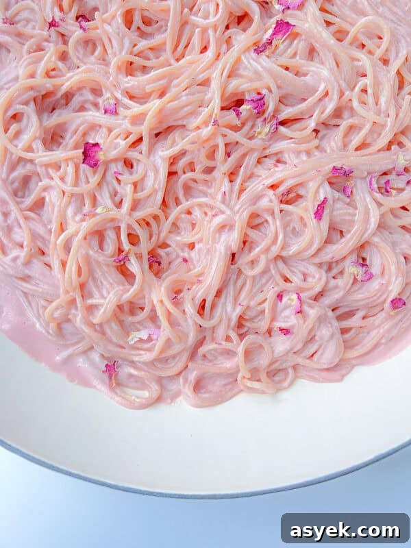Close-up of Pink Pasta coated in a creamy, pastel pink sauce