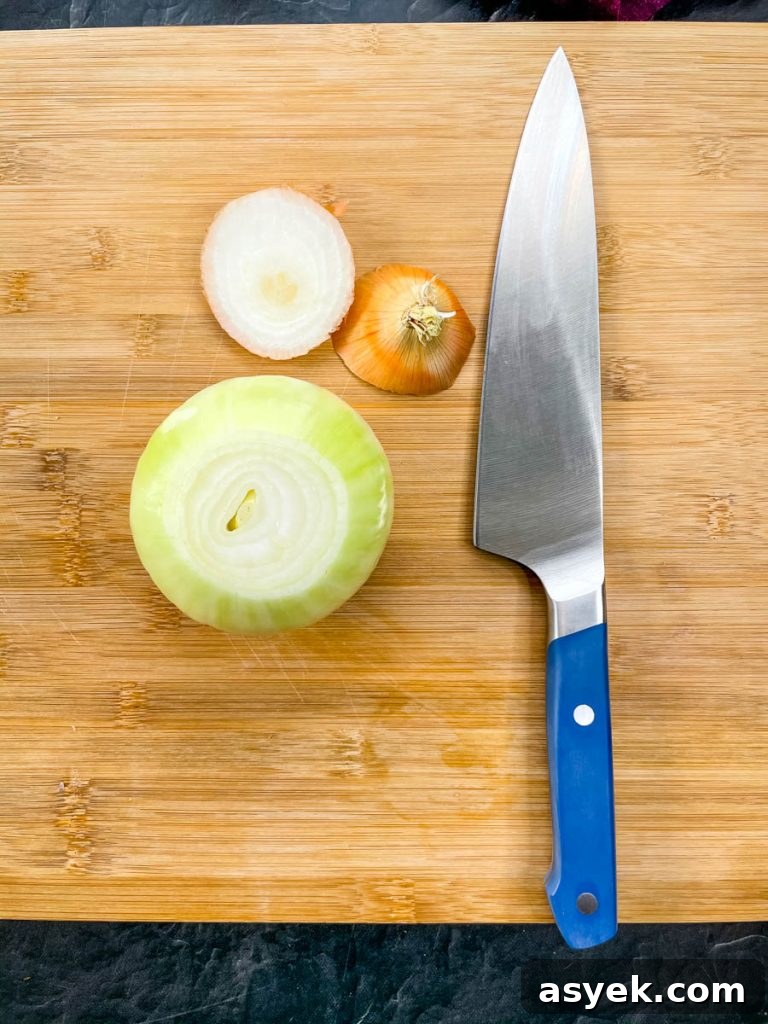 Raw vidalia onion on a cutting board