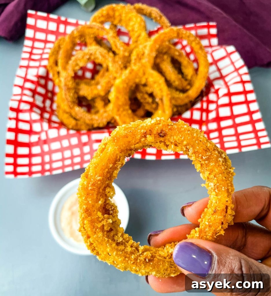 person holding a keto low carb onion ring