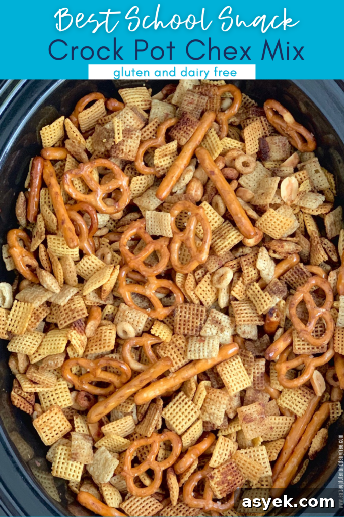 A crockpot full of pretzel twist and rods, peanuts, chex cereal, seasonings, and whole o cereal.