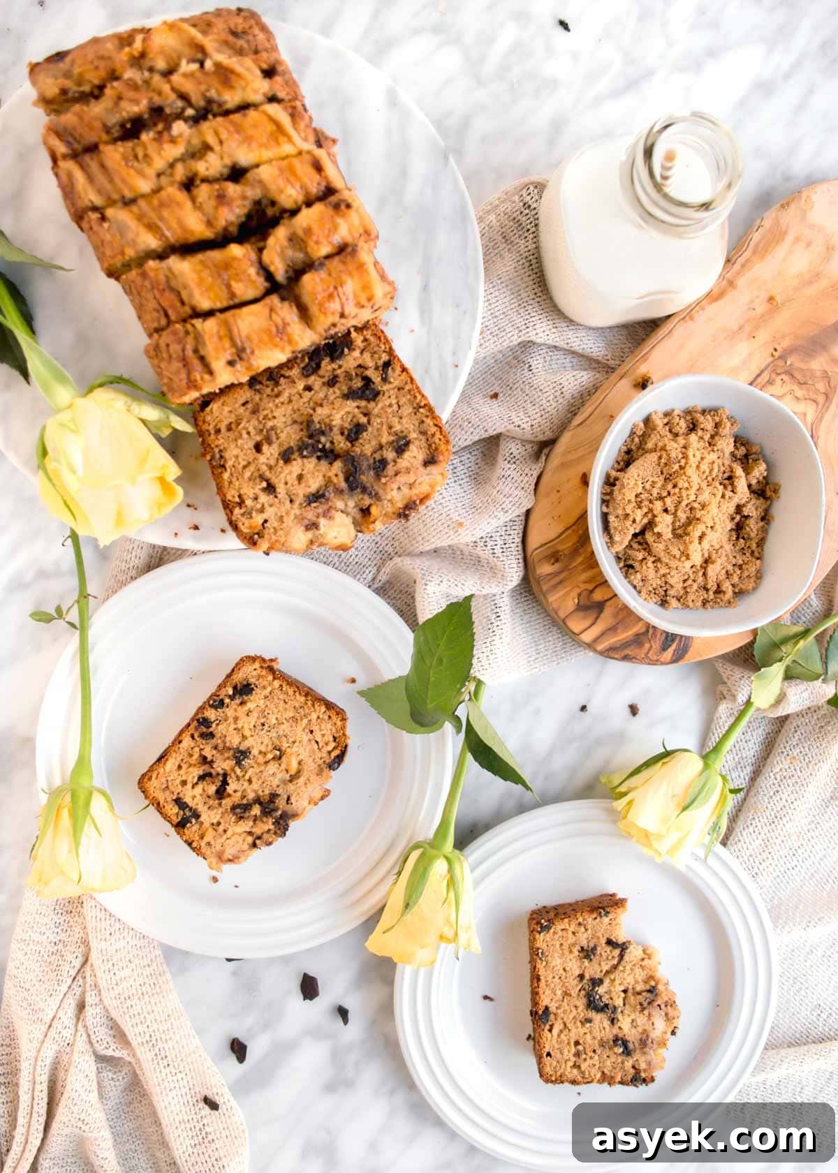 Slices of Chocolate Chip Banana Bread with Walnuts on plates with loaf flatlay.