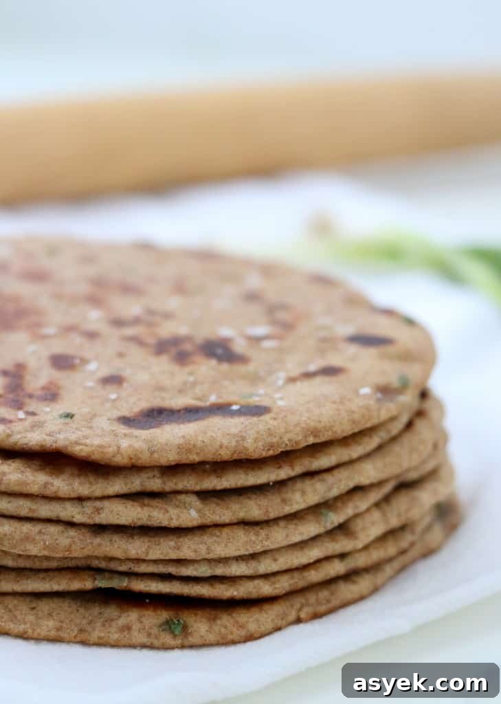 Soft Whole Wheat Rye Flatbread Recipe with Scallions 9 Close up of stack of flatbreads with a rolling pin