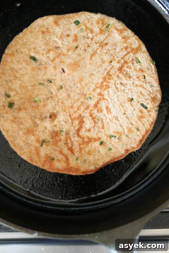 Soft Whole Wheat Rye Flatbread Recipe with Scallions 6 flatbread cooking in a cast iron skillet