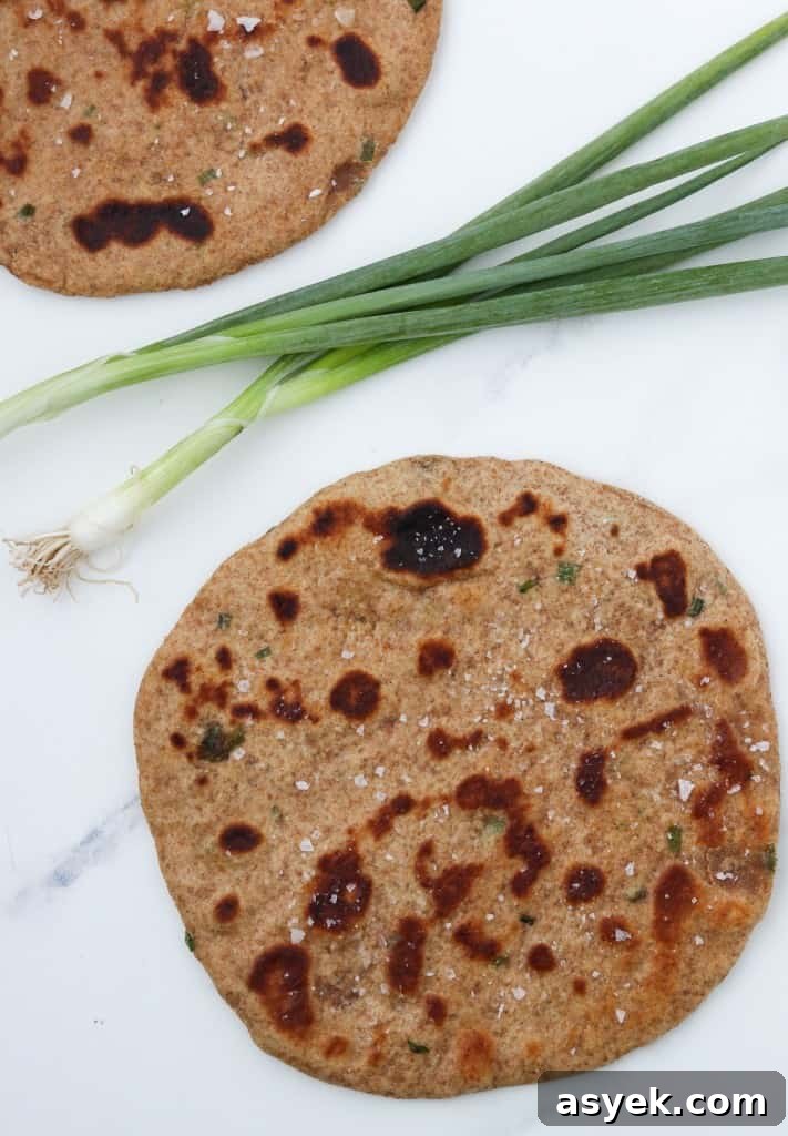 Soft Whole Wheat Rye Flatbread Recipe with Scallions 8 Flatbreads on a countertop with scallions
