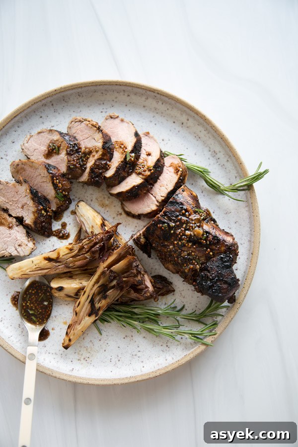 Balsamic Pork Loin Marinade for Grilling or Roasting 17 grilled balsamic pork tenderloin with easy marinade sliced on a plate