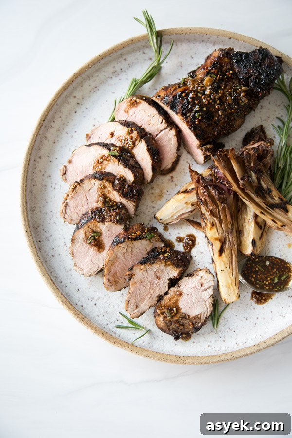 Balsamic Pork Loin Marinade for Grilling or Roasting 18 grilled pork tenderloin with balsamic marinade sliced on a plate