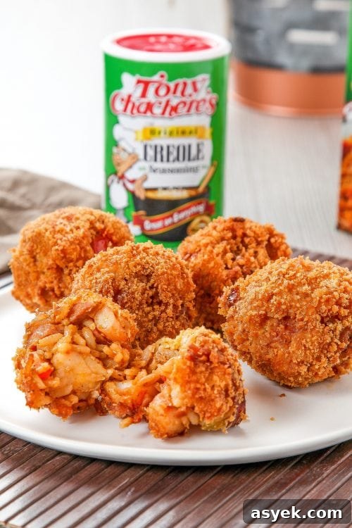 Crispy Deep-Fried Jambalaya Recipe 4 deep fried jambalaya balls with tony chachere's seasoning in the background