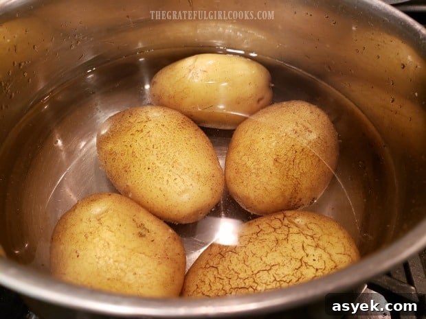 Cheesy Skillet Potatoes - The Grateful Girl Cooks! Par-boiling the potatoes for 8-9 minutes in water.