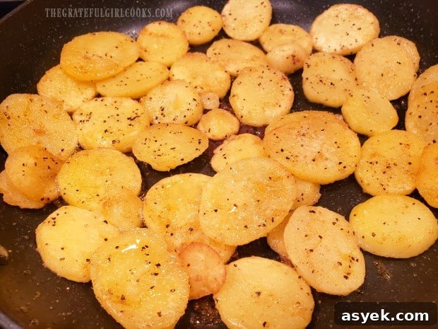 Cheesy Skillet Potatoes - The Grateful Girl Cooks! Skillet potatoes turn golden brown, and slightly crispy on the edges.