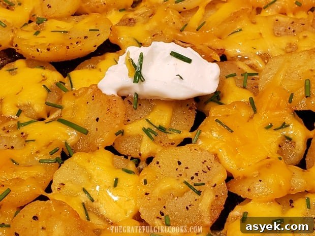 Cheesy Skillet Potatoes - The Grateful Girl Cooks! The final garnish for the cheesy skillet potatoes is a dollop of sour cream.