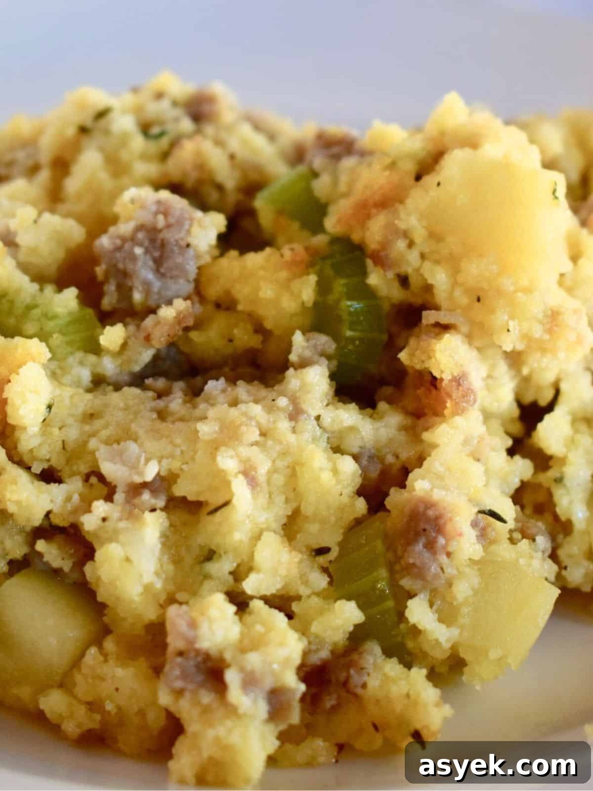 Savory Cornbread Stuffing with Sausage and Apples 2 Cornbread Stuffing with Sausage and apples on a white plate.