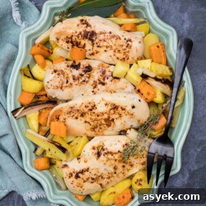 sheet pan roasted chicken on platter with fork and napkin
