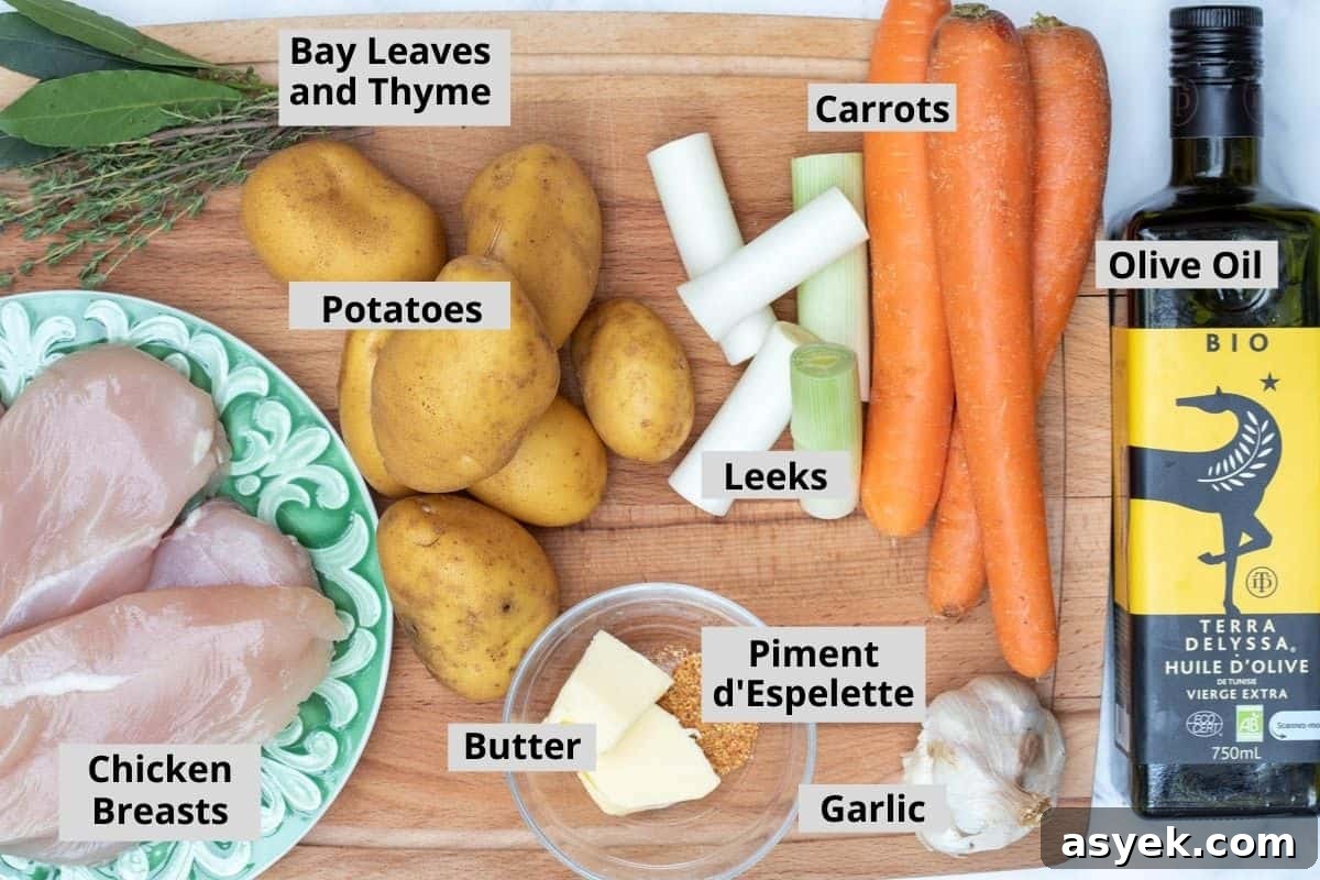 Crispy Sheet Pan Chicken and Roasted Potatoes Recipe 3 chicken breasts, bay leaves, thyme, potatoes, leeks, butter, piment d'espelette, garlic, carrots, and olive oil