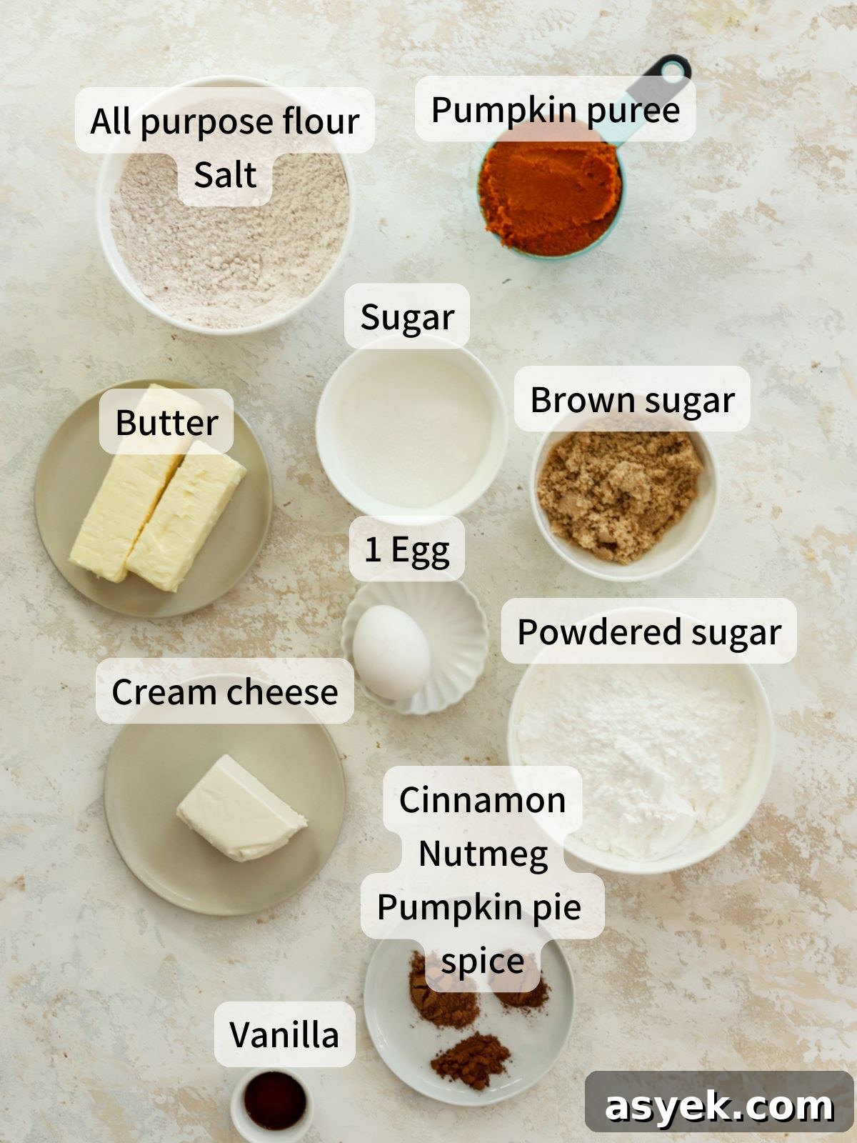 Pumpkin Whoopie Pies with Cream Cheese Filling 3 Labeled ingredients needed to make pumpkin whoopie pies laid out on a table.