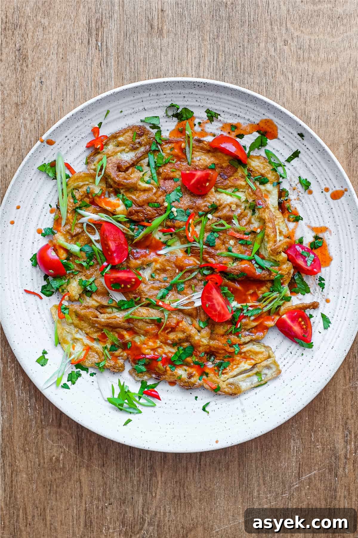 Thai Omelette (Kai Jeow) | cookeatworld.com A plate of Thai Omelette