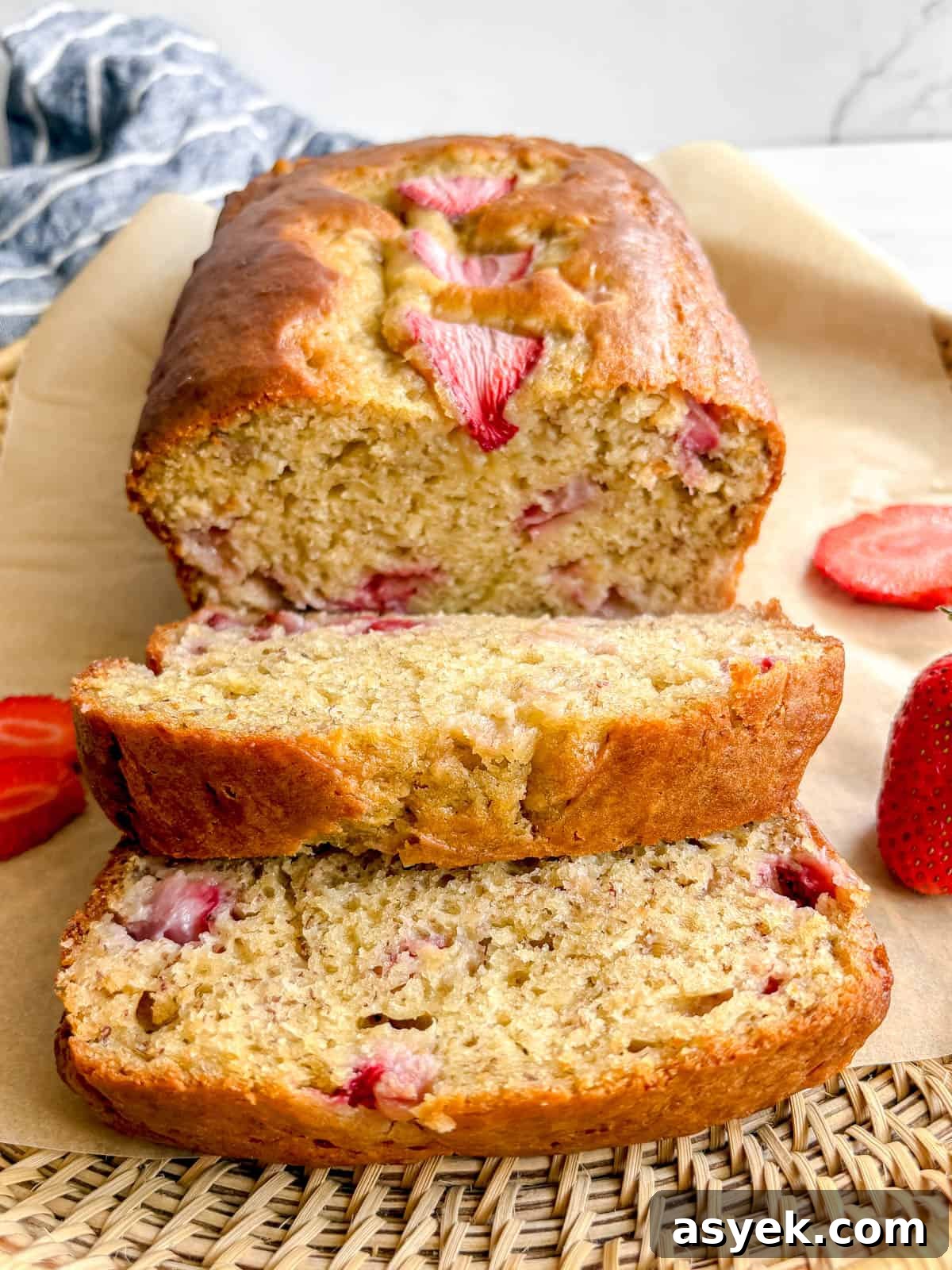 A few slices of strawberry banana loaf on a plate.