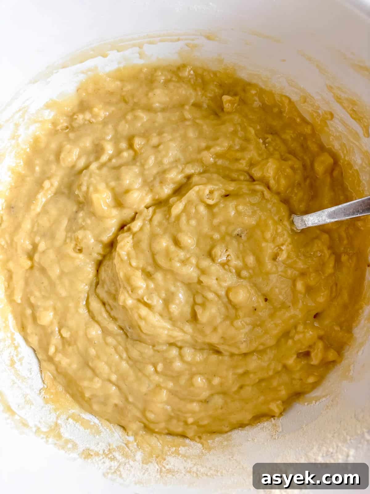 Wet and dry ingredients mixed together for strawberry banana bread.