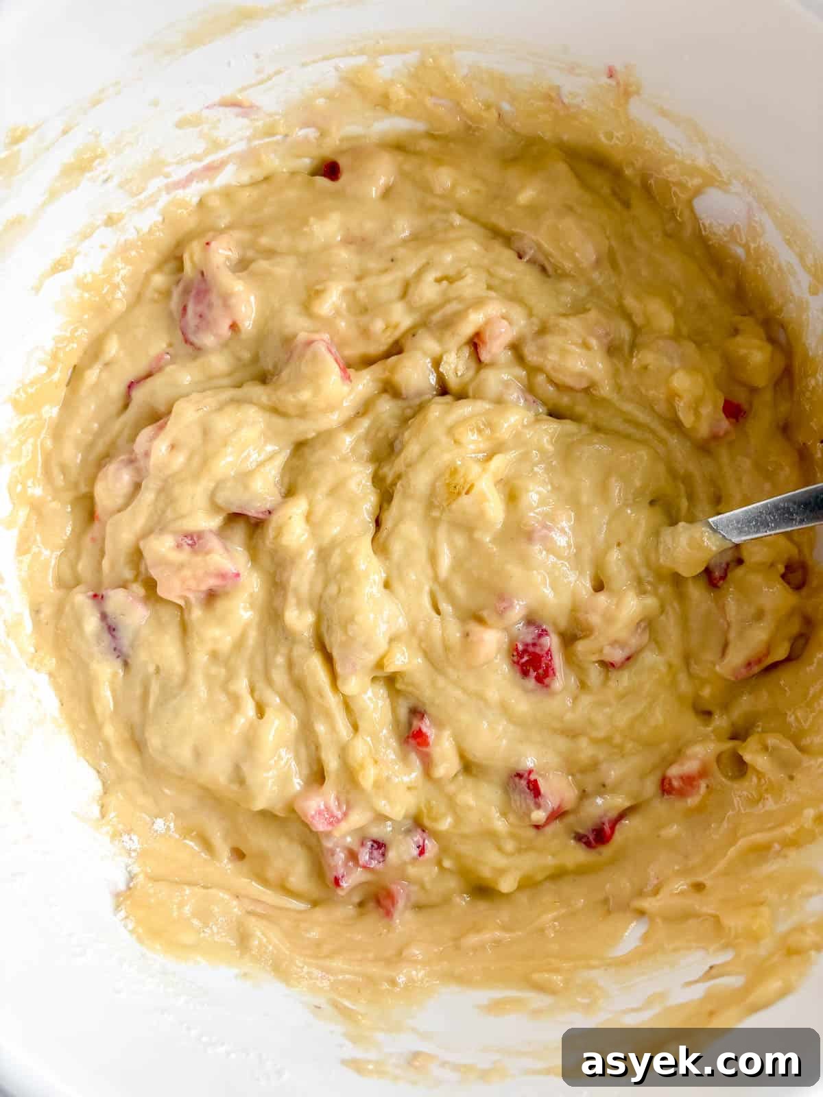 Chopped strawberries folded into the banana bread batter.