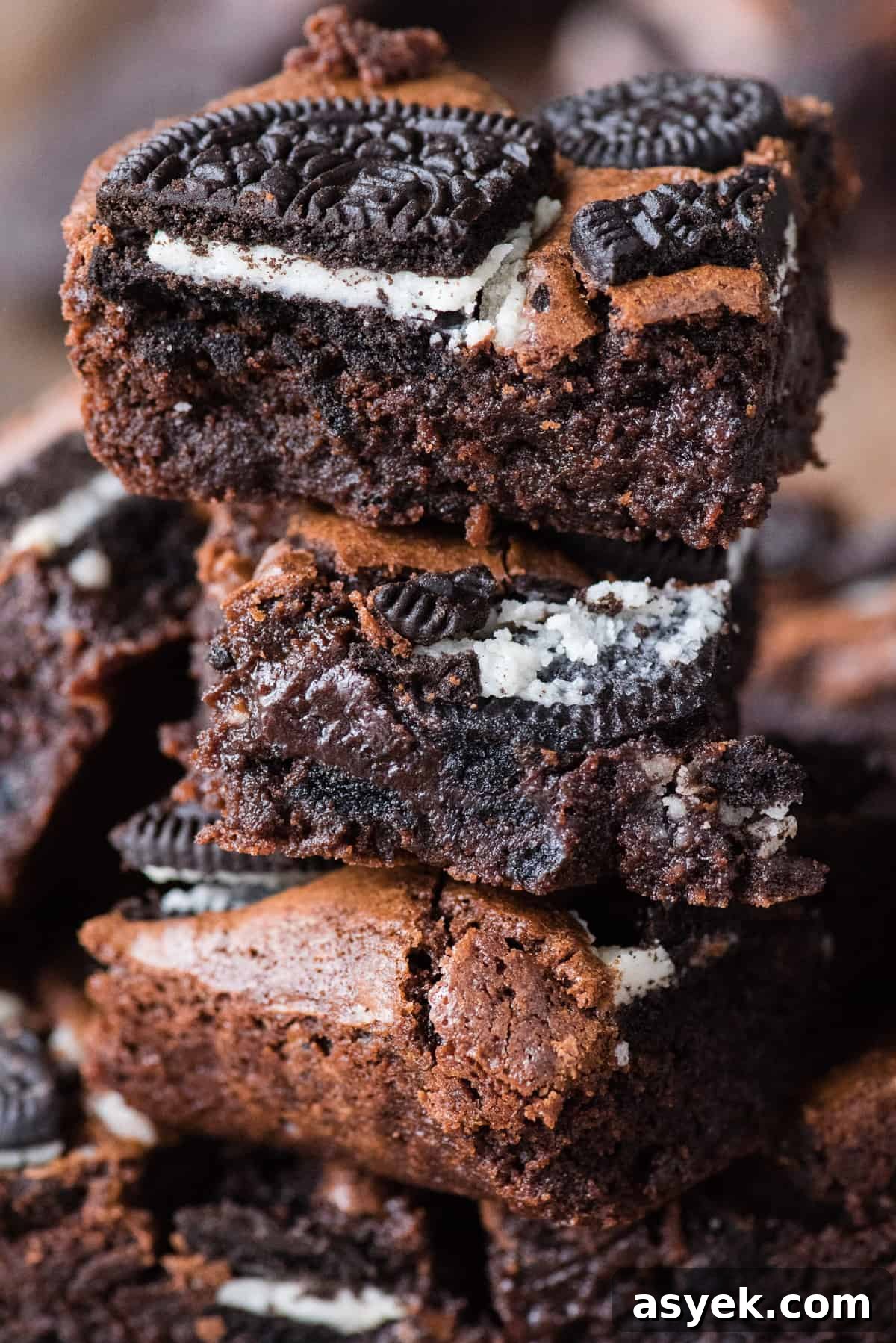 4 oreo brownies cut into squares and stacked on top of each other