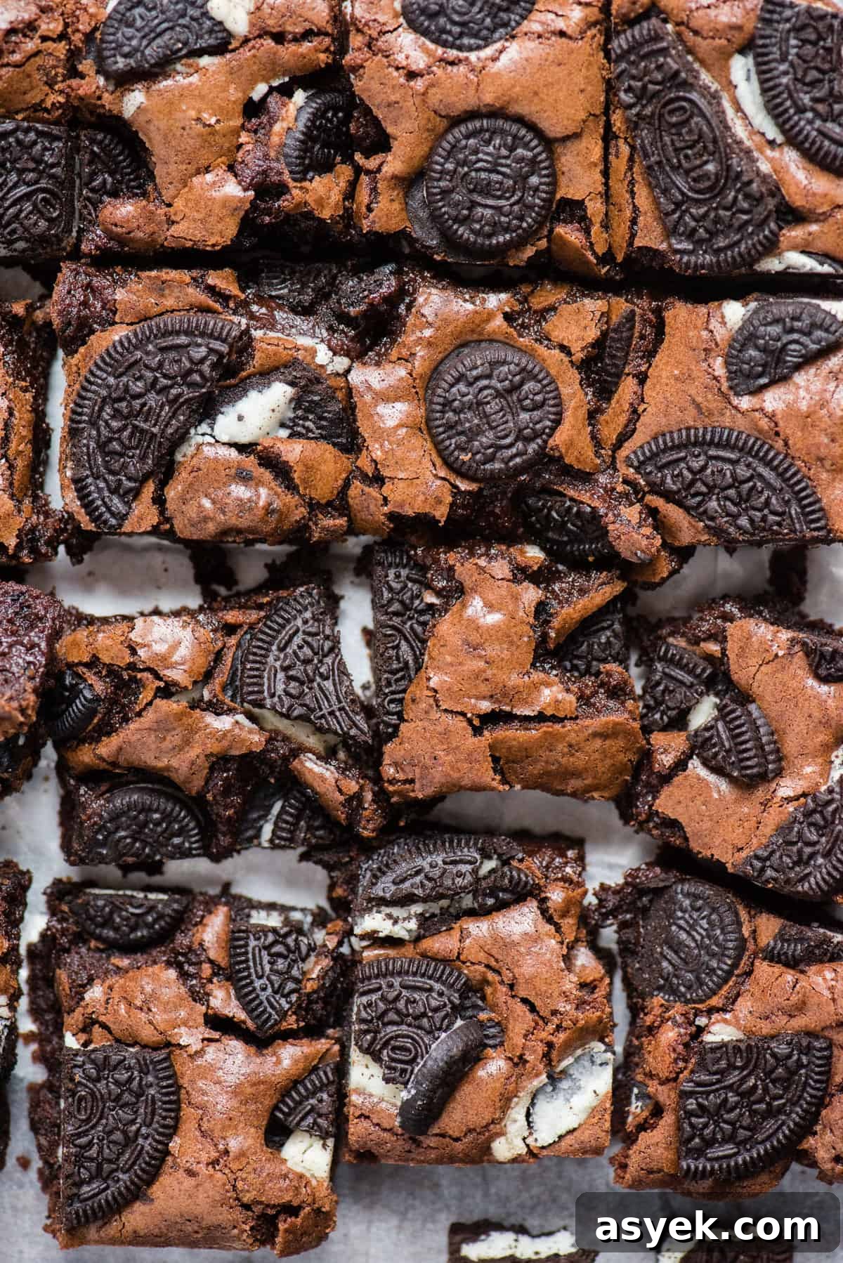 homemade brownies with oreo cookie pieces baked on top cut into squares