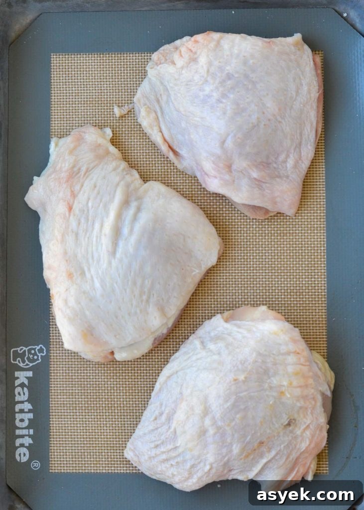 Dry and season chicken thighs