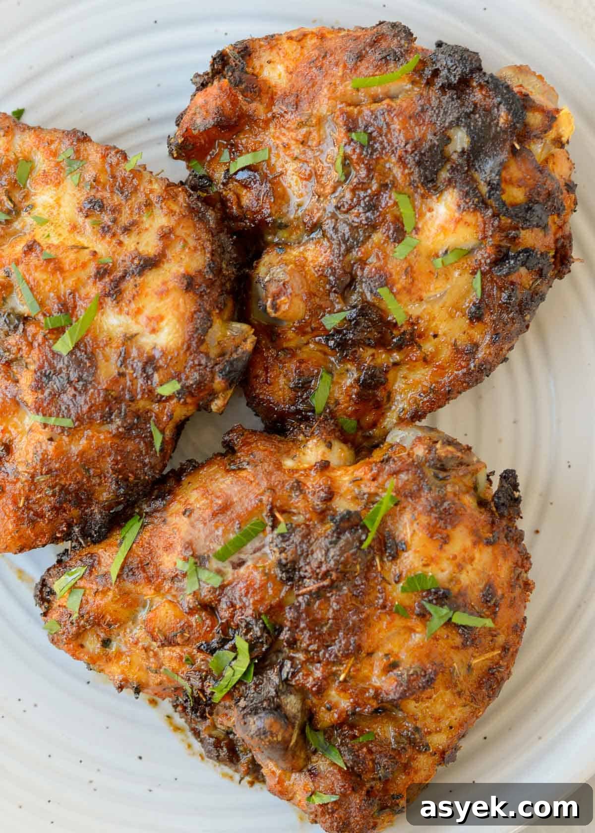 Plated Cajun chicken thighs