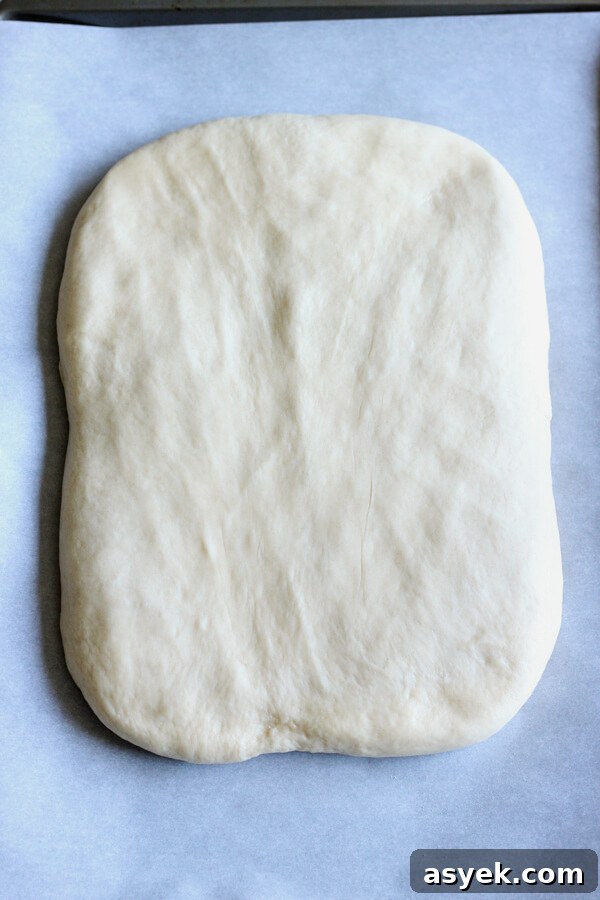 How to Make Butter Croissants at Home — Croissant Series Part 1 8 Flattened butter croissant dough prepped for lamination.