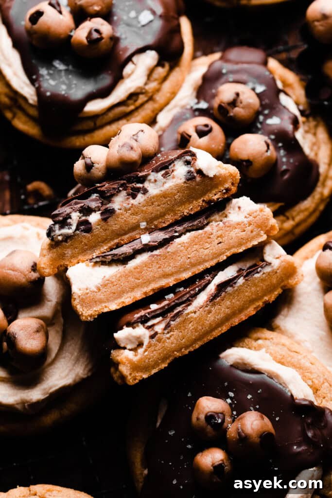 A stack of three cookie halves, showing the thick and chewy insides of the cookie dough cookies.
