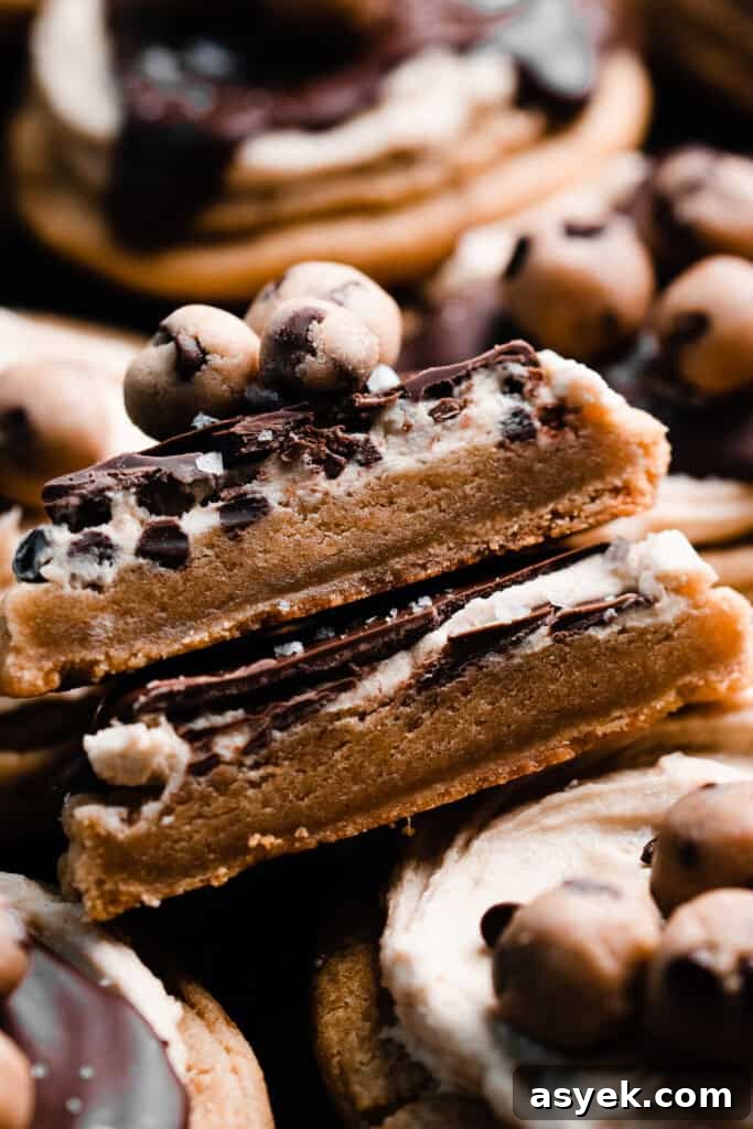 A close-up of a stack of two cookie halves, showing the chewy insides.