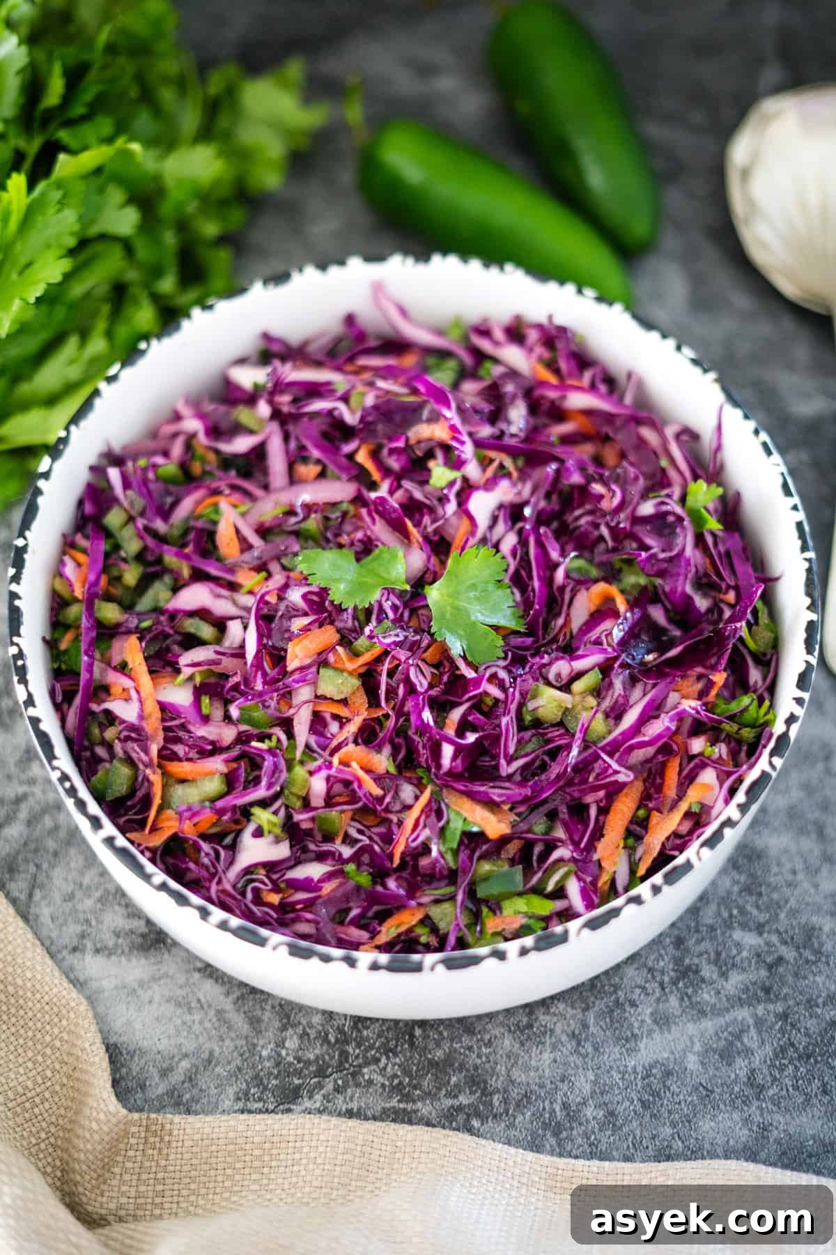 Purple Cabbage Coleslaw Recipe with Zesty Dressing 7 Purple cabbage slaw in a bowl.
