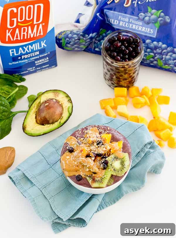 With summer quickly approaching, this superfood smoothie bowl will keep you cool and fueled on the sunniest days. Wild blueberries, spinach, avocado, and flaxmilk combine to form a creamy, antioxidant-packed bowl that is vegan and gluten-free! Slices of fresh kiwi and a drizzle of almond butter make this smoothie bowl practically irresistible.