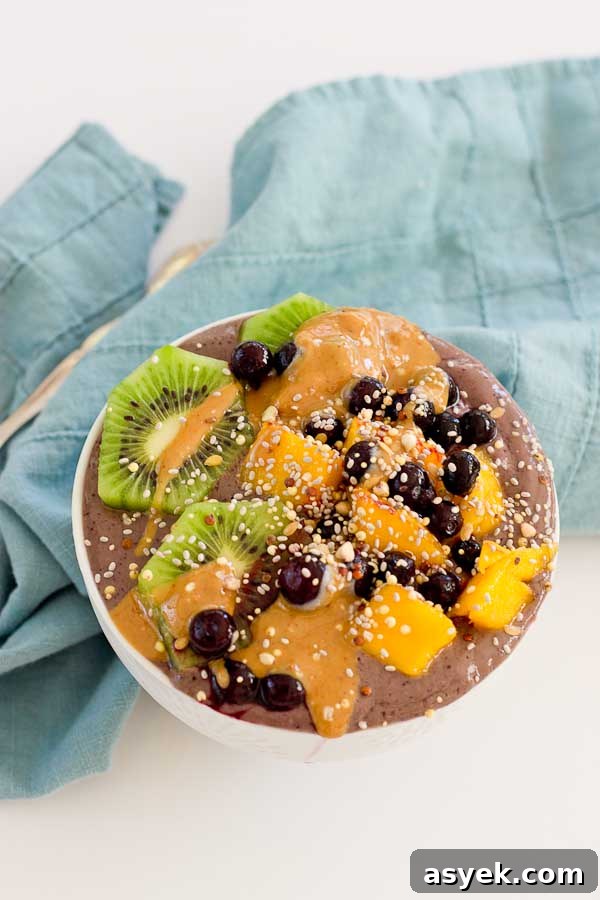 With summer quickly approaching, this superfood smoothie bowl will keep you cool and fueled on the sunniest days. Wild blueberries, spinach, avocado, and flaxmilk combine to form a creamy, antioxidant-packed bowl that is vegan and gluten-free! Slices of fresh kiwi and a drizzle of almond butter make this smoothie bowl practically irresistible.