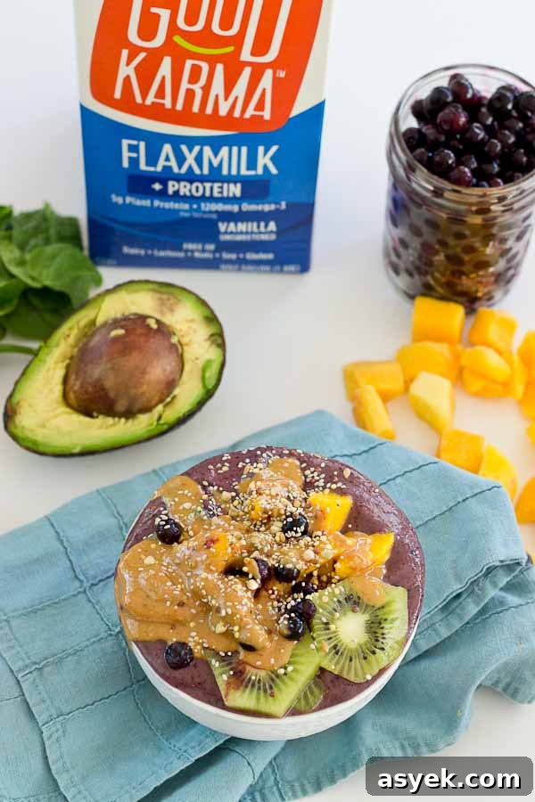 With summer quickly approaching, this superfood smoothie bowl will keep you cool and fueled on the sunniest days. Wild blueberries, spinach, avocado, and flaxmilk combine to form a creamy, antioxidant-packed bowl that is vegan and gluten-free! Slices of fresh kiwi and a drizzle of almond butter make this smoothie bowl practically irresistible.