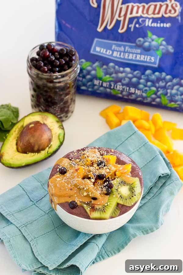 With summer quickly approaching, this superfood smoothie bowl will keep you cool and fueled on the sunniest days. Wild blueberries, spinach, avocado, and flaxmilk combine to form a creamy, antioxidant-packed bowl that is vegan and gluten-free! Slices of fresh kiwi and a drizzle of almond butter make this smoothie bowl practically irresistible.