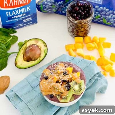 With summer quickly approaching, this superfood smoothie bowl will keep you cool and fueled on the sunniest days. Wild blueberries, spinach, avocado, and flaxmilk combine to form a creamy, antioxidant-packed bowl that is vegan and gluten-free! Slices of fresh kiwi and a drizzle of almond butter make this smoothie bowl practically irresistible.