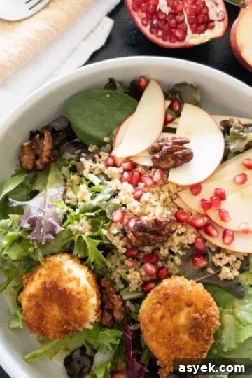 Apple salad topped with fried goat cheese