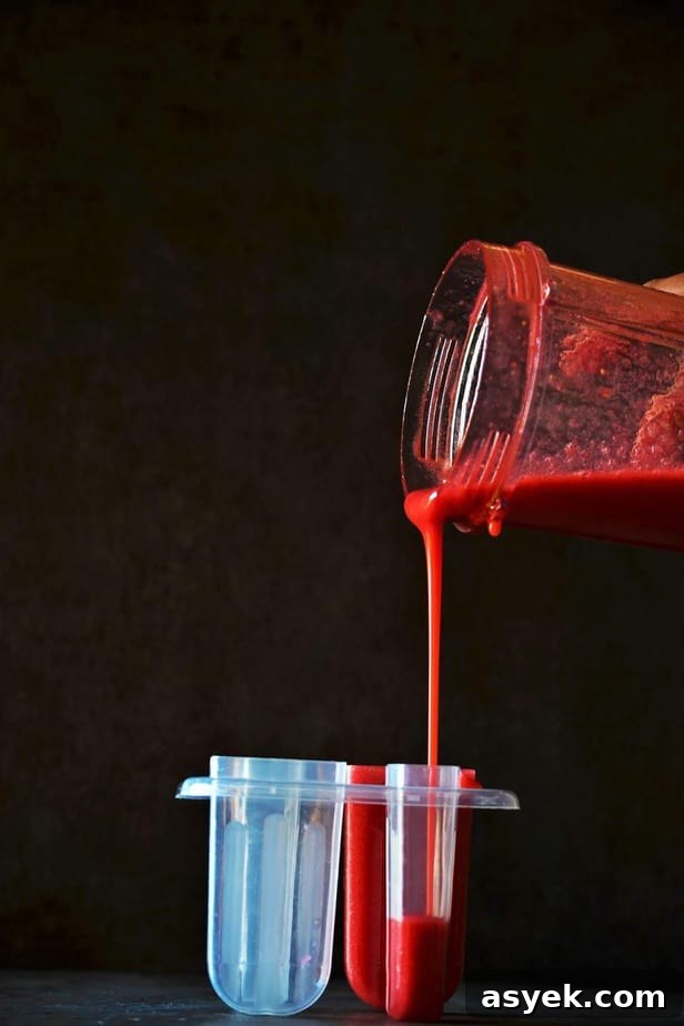 Strawberry juice poured in the ice-cream mould