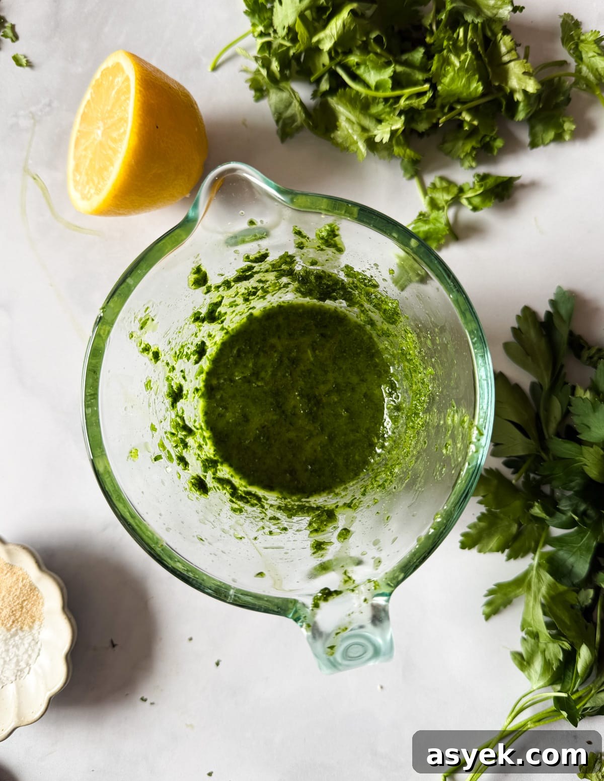 herb olive oil in a glass measuring cup. 