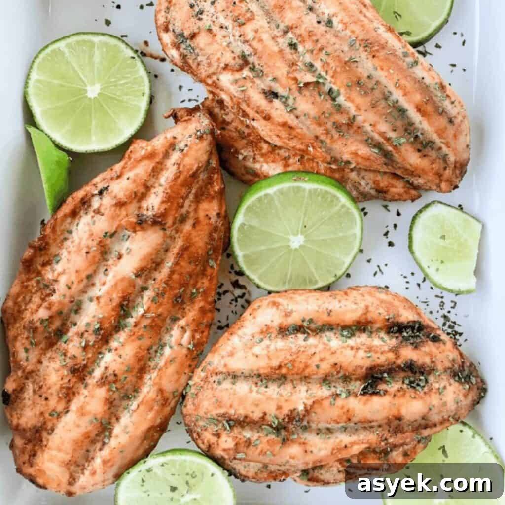 Chili lime chicken smoked to perfection and served with slices of fresh lime and garnished with parsley.