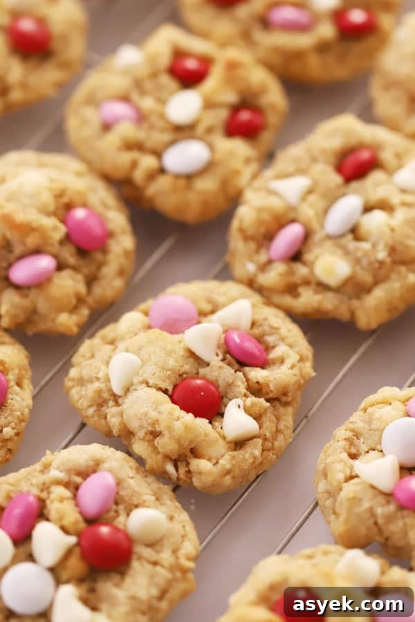 Chewy White Chocolate Coconut Cookie Recipe 2 A cooling rack full of white chocolate coconut cookies.