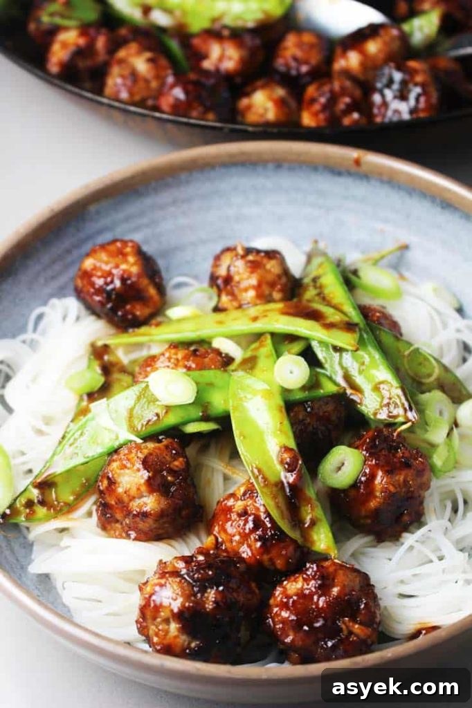 5 Quick Date Night Dinner Ideas for a Romantic Evening 4 Asian meatballs with honey and sriracha in a bowl over rice noodles and snow peas