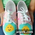 pair of pink painted shoes with flowers