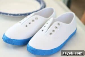 white canvas shoes wrapped with painter's tape