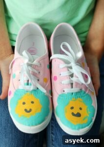 pair of pink painted shoes with flowers