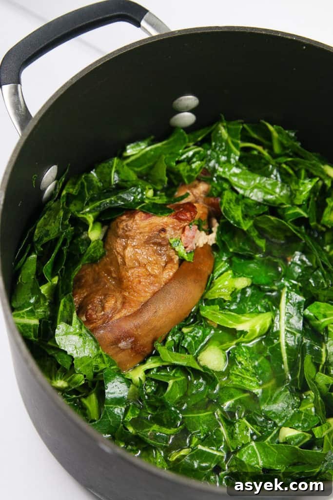 bowl of cooked collard greens with ham