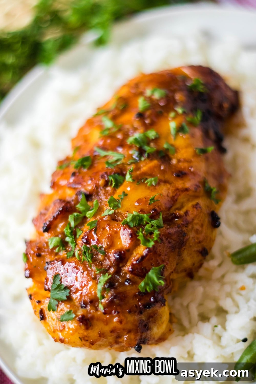 air fryer hot honey chicken breast on top of a bed of rice