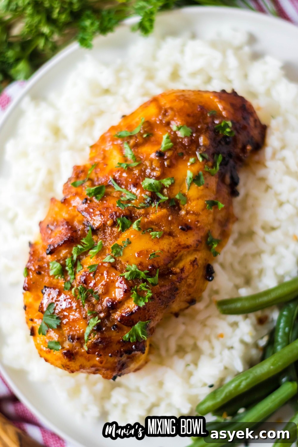 air fryer hot honey chicken breast on top of a bed of rice
