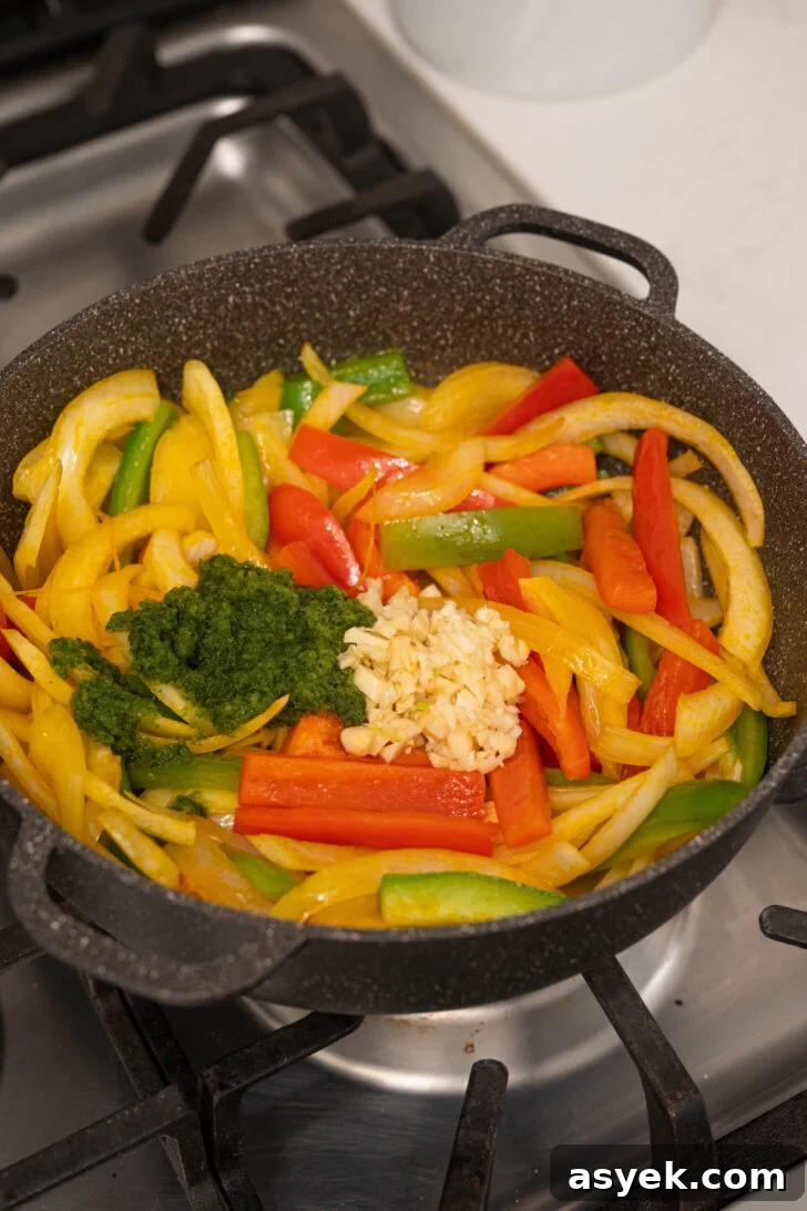A pot with peppers, onions, and more.