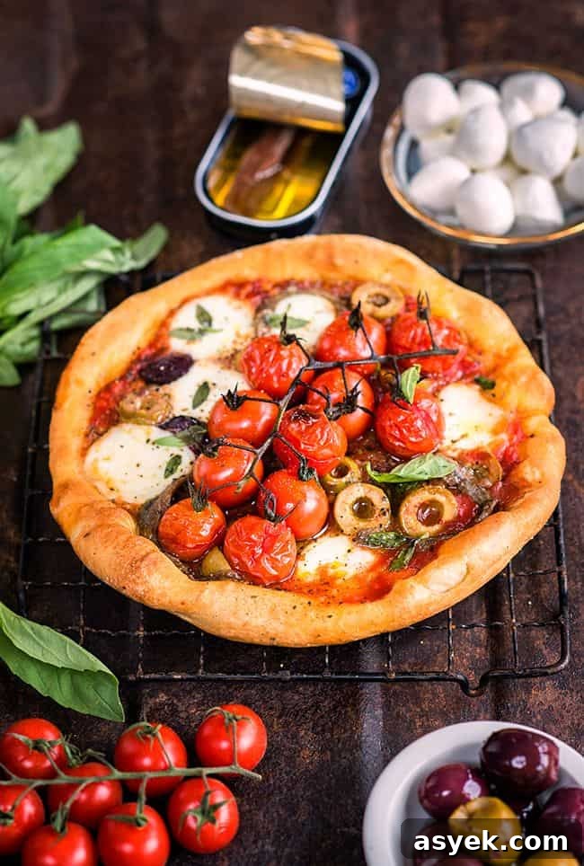 Puttanesca skillet pizza with olives, anchovies and mozzarella