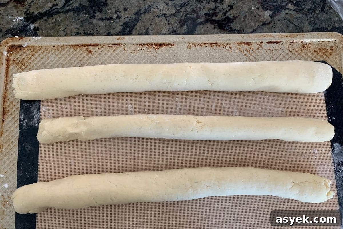 A photo showing three dough ropes ready to braid.